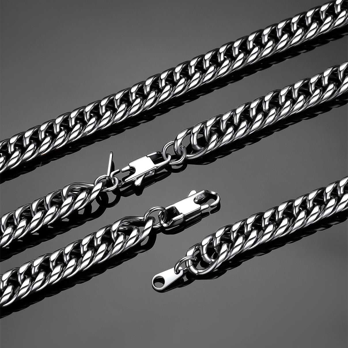 silver cuban chain necklaces on a gray background