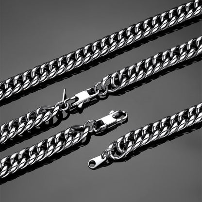 silver cuban chain necklaces on a gray background