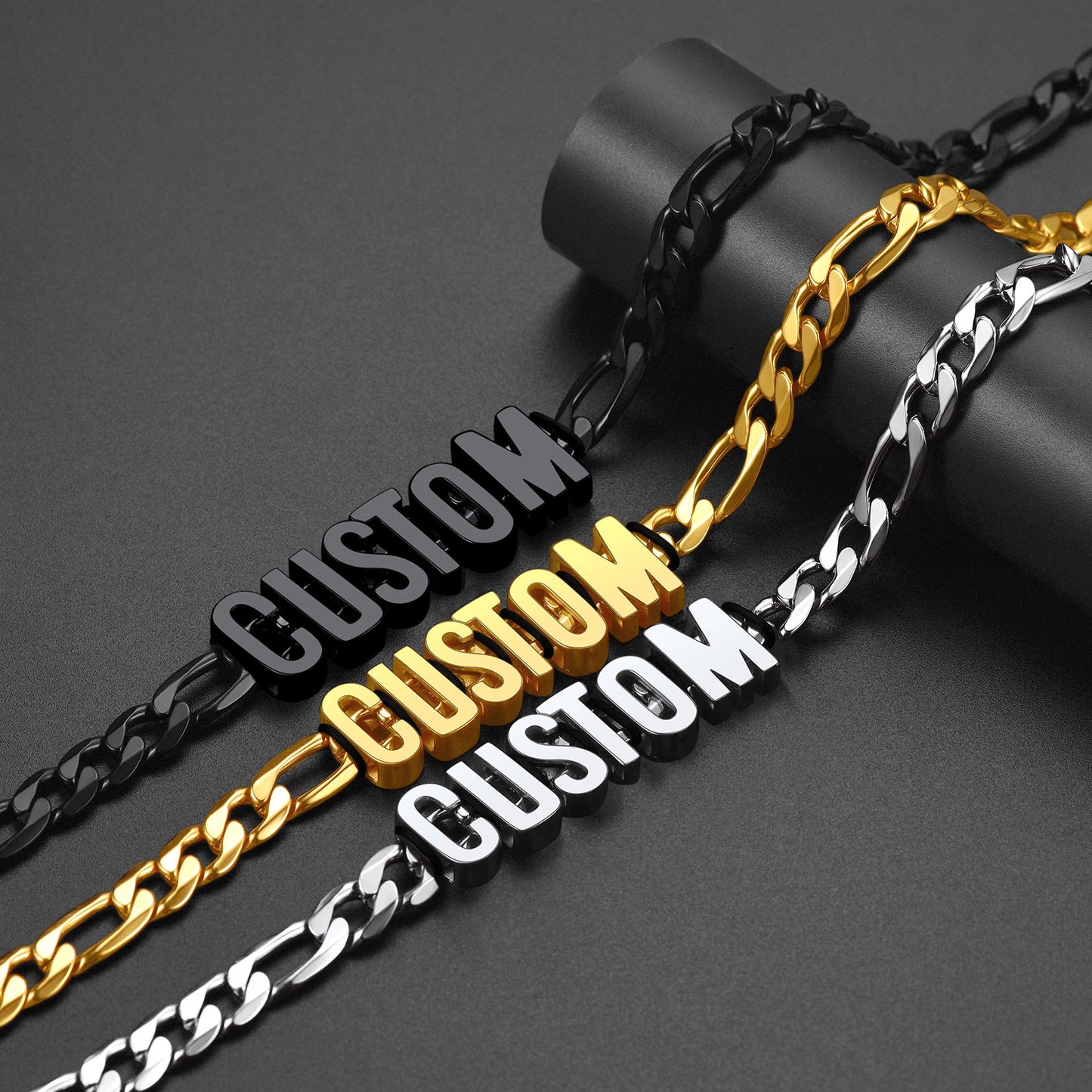 Three chains with 'CUSTOM' labels in black, gold, and silver on a dark background