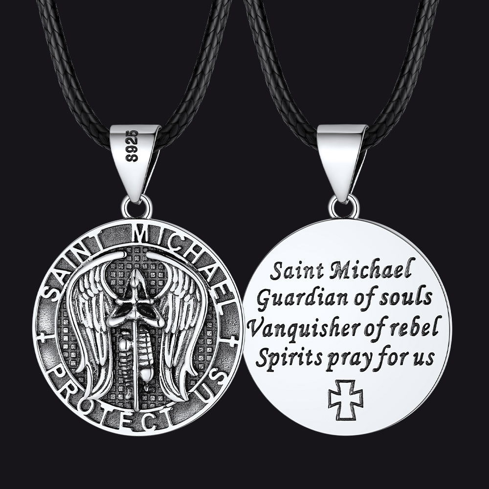 Saint Michael pendant necklaces on black cords with detailed designs.
