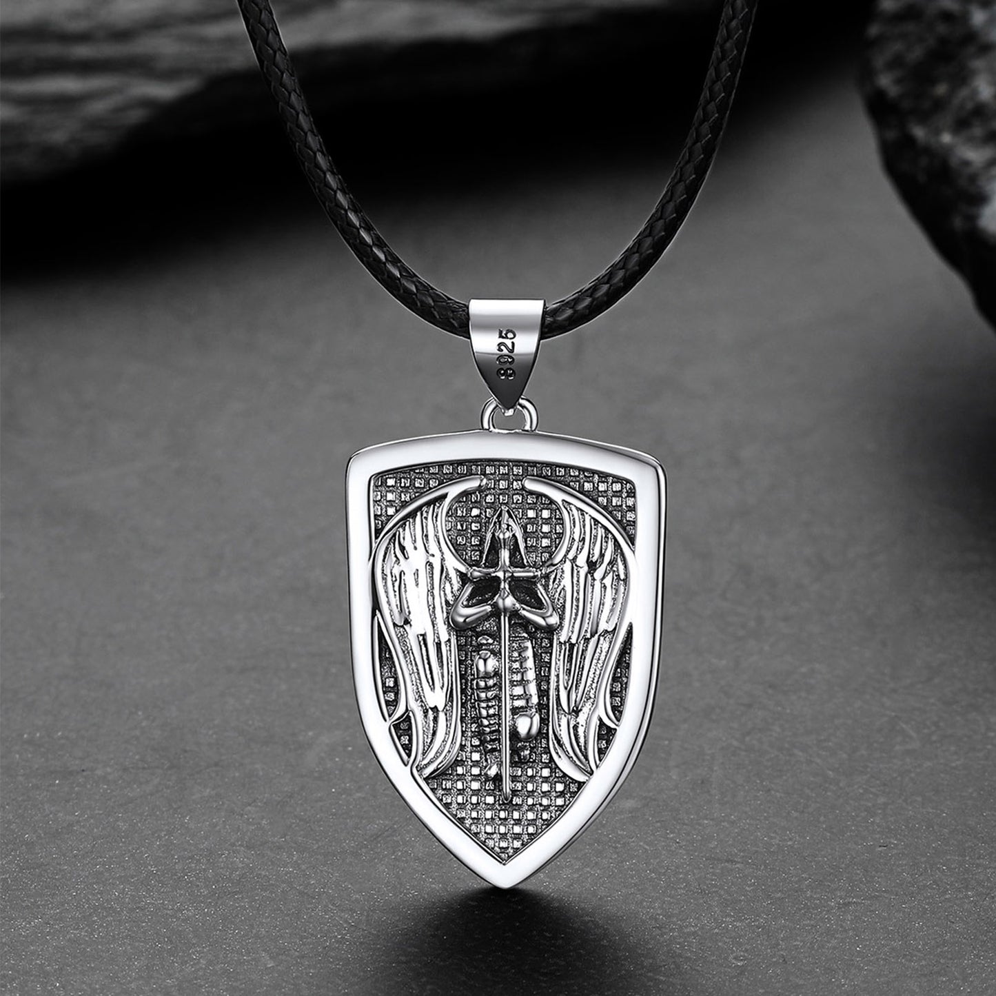 Silver pendant with intricate design