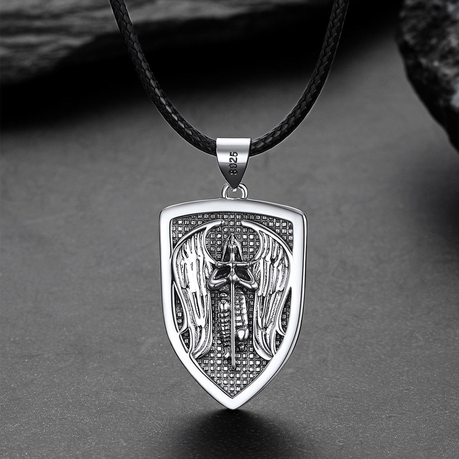 Silver pendant with intricate design