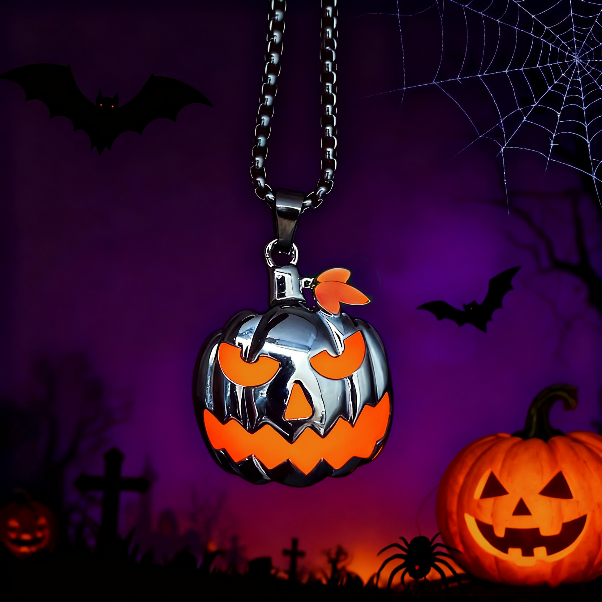 Halloween necklace pendant with glowing pumpkin and skull detail