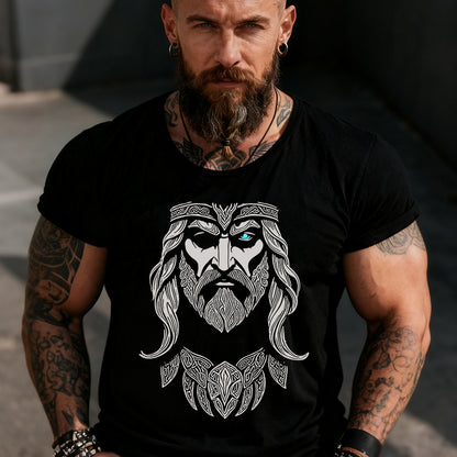 Man wearing a black t-shirt with a white graphic design of a bearded warrior on a dark background