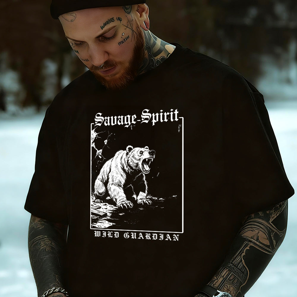 Person wearing a black t-shirt with a bear graphic and 'Savage Spirit' text in a snowy landscape