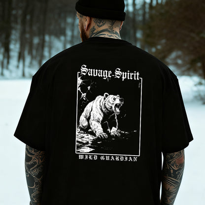 Person wearing a black t-shirt with a bear graphic and 'Savage Spirit' text in a snowy forest setting