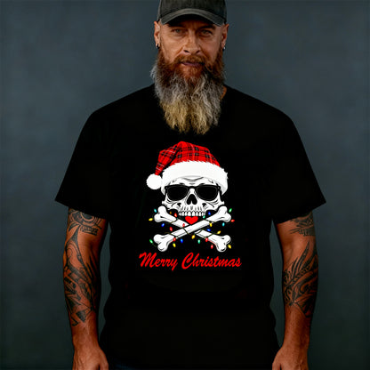 Man wearing a black t-shirt with a Christmas-themed skull design on a dark background