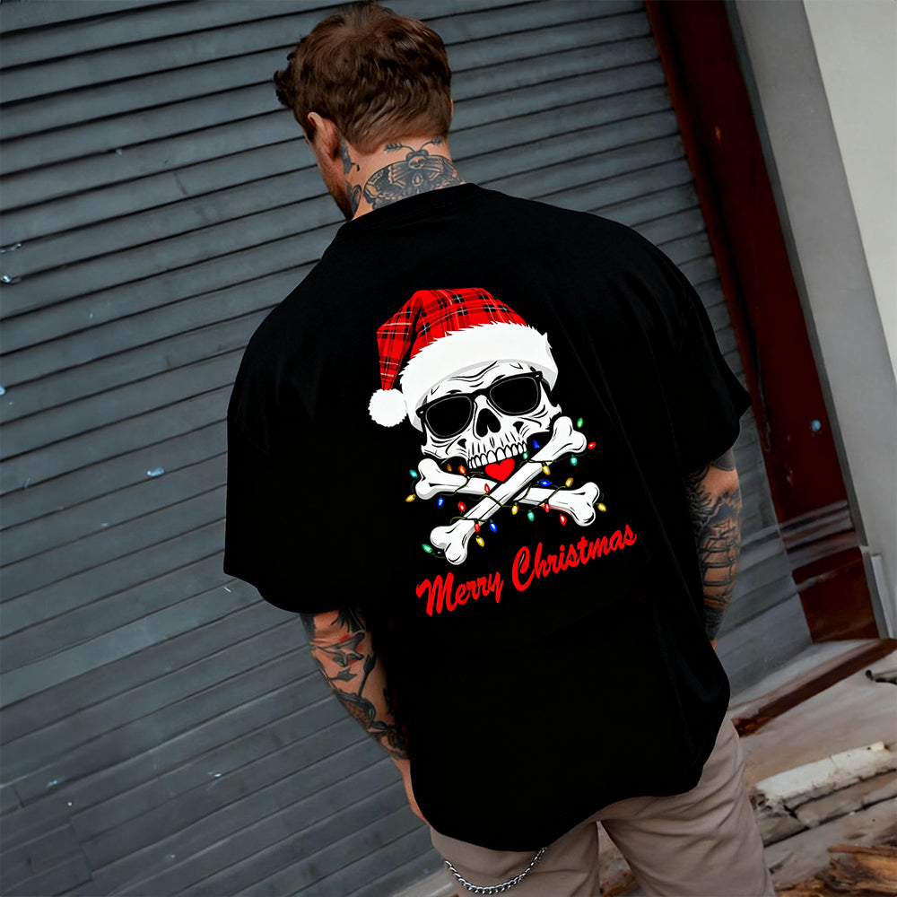 Person wearing a black t-shirt with a Christmas-themed skull design.