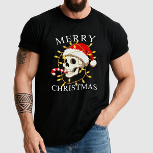 Person wearing a black t-shirt with a skull wearing a Santa hat and Christmas lights design, text 'Merry Christmas'.