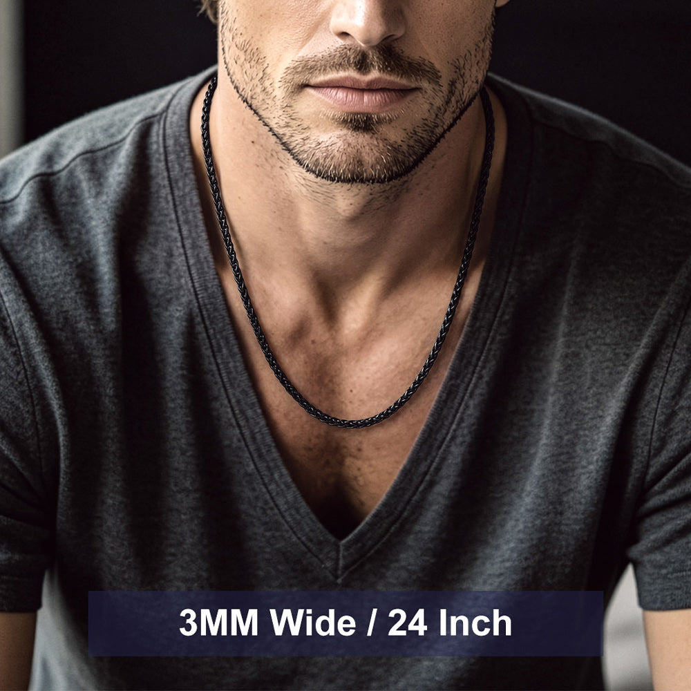 A man wearing a dark gray V-neck t-shirt and a thick black 3mm wide 24-inch chain necklace.