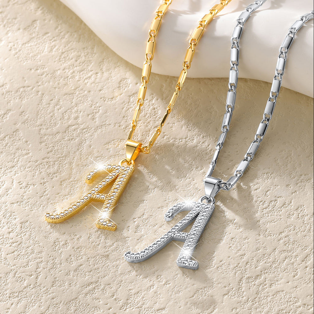 Gold and silver initial letter necklace with cubic zirconia crystals for women.