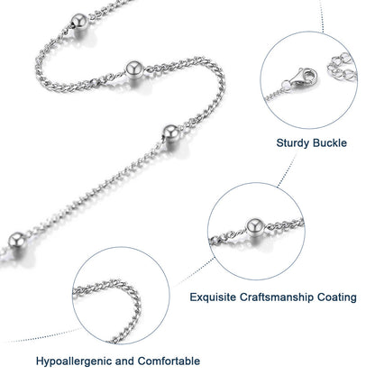 Silver necklace with detailed views of buckle, coating, and comfort on a white background