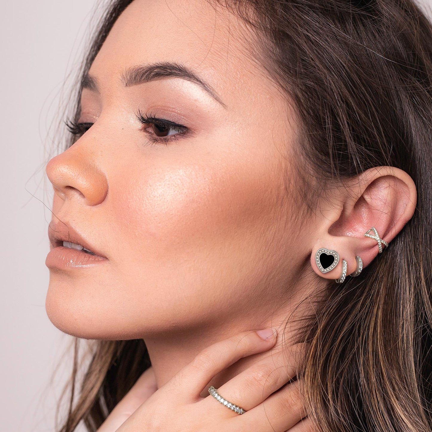 Close-up of a woman wearing Heart-shaped Black Onyx Stud Earring