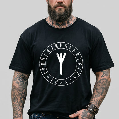 Man wearing a black t-shirt with a white rune symbol design on a gray background