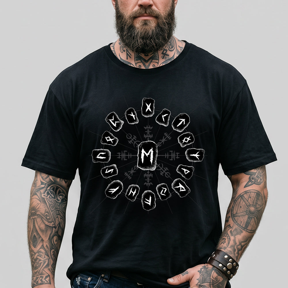 Man wearing a black t-shirt with white viking rune symbols and lettering on a gray background