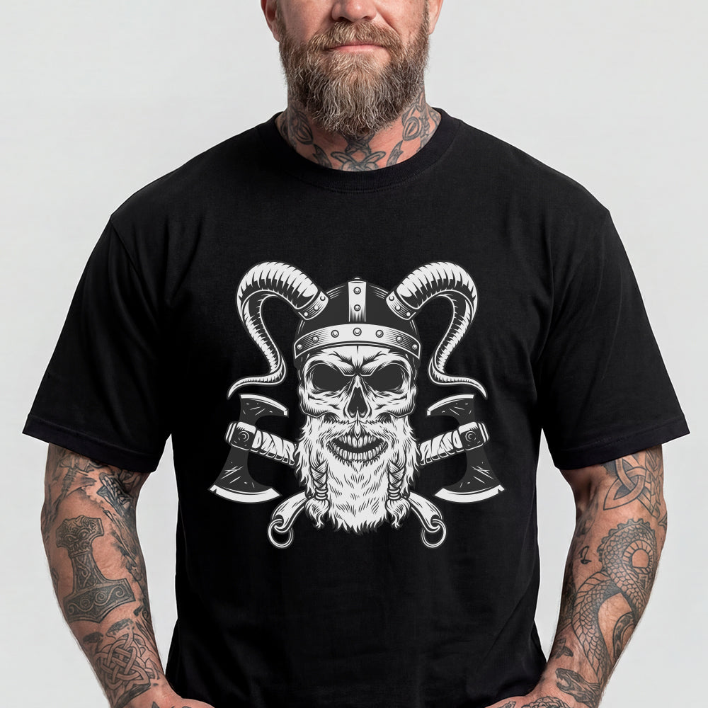 Man wearing a black t-shirt with a skull and crossed axes design on a plain background