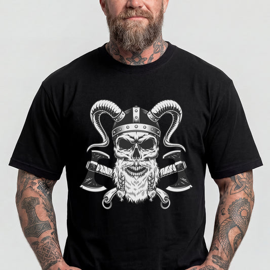 Man wearing a black t-shirt with a skull and crossed axes design on a plain backgroundimg