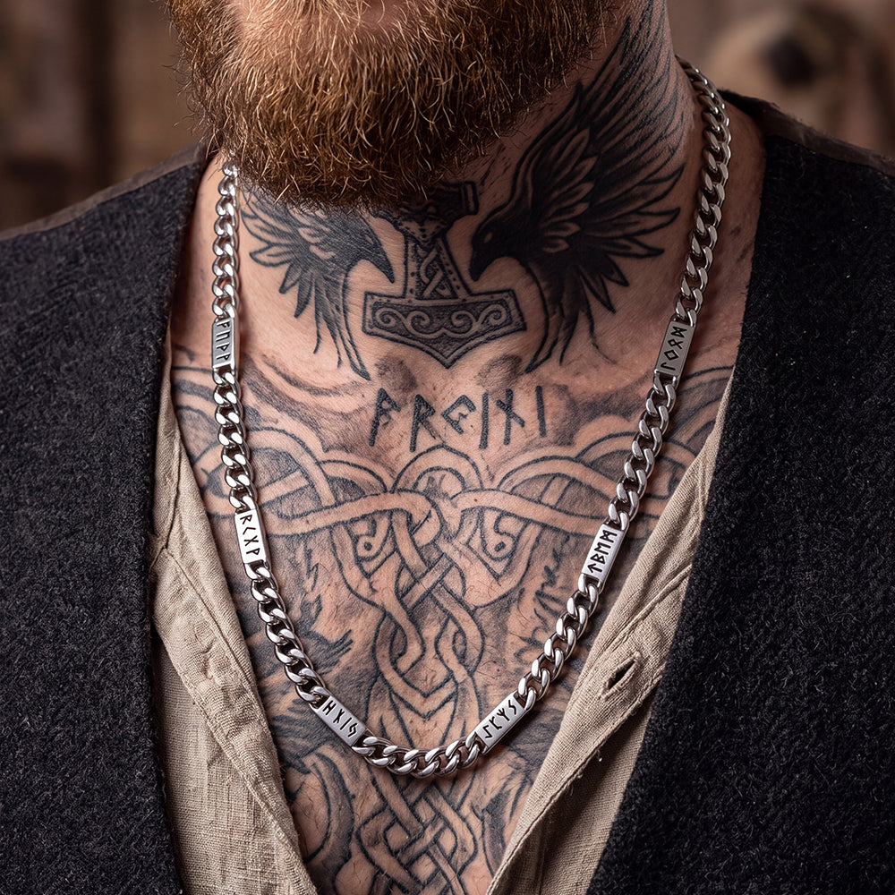 Man wearing Viking rune Futhark alphabet Cuban link chain necklace in steel finish
