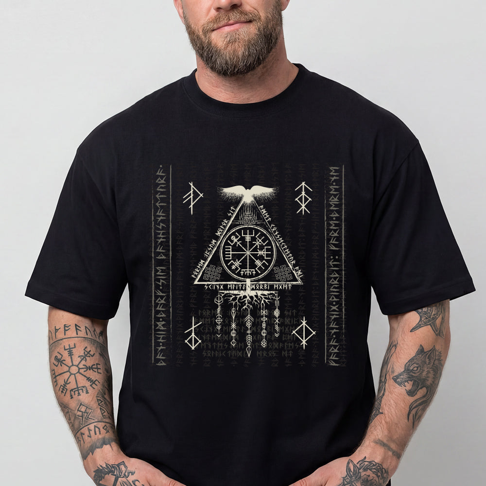 Man wearing a black t-shirt with white geometric design and text.