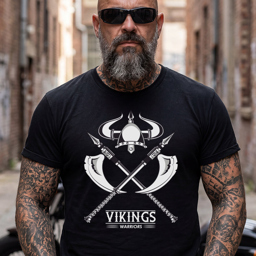 Man wearing a black t-shirt with a Viking Warriors Horned Helmet design and text, standing in an urban setting.