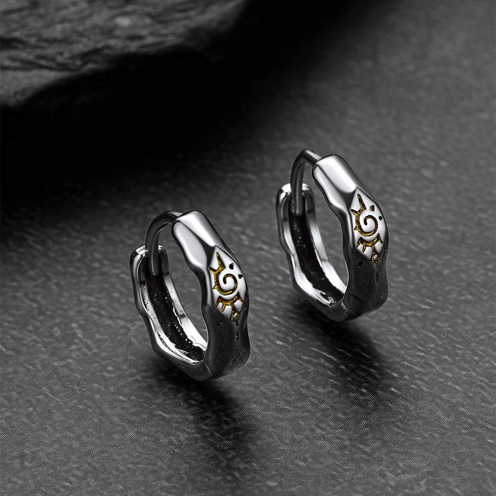 Silver Wishing Stone Sun Pattern Hoop Earrings on a dark surface