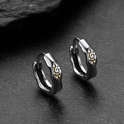 Silver Wishing Stone Sun Pattern Hoop Earrings on a dark surface