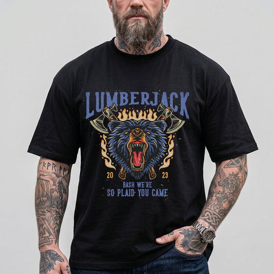 Man wearing a black t-shirt with a bear graphic and text, standing against a plain backgroundimg