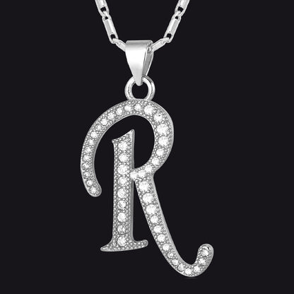 Silver Cubic Zirconia Initials R Necklace with a 'R' pendant on a black background
